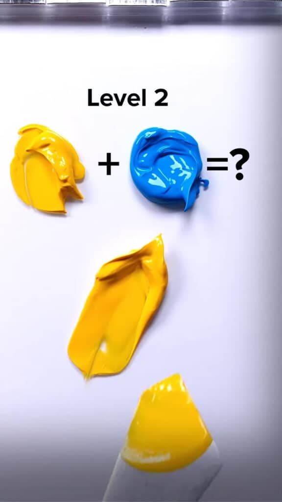 黄色と青色の絵具を混ぜていく