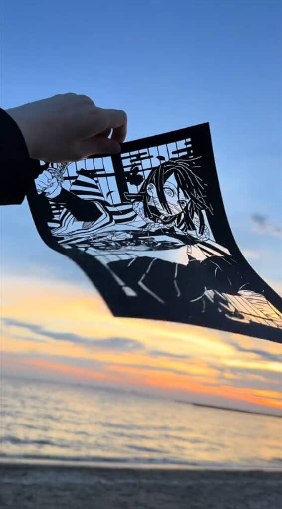 風になびく切り絵