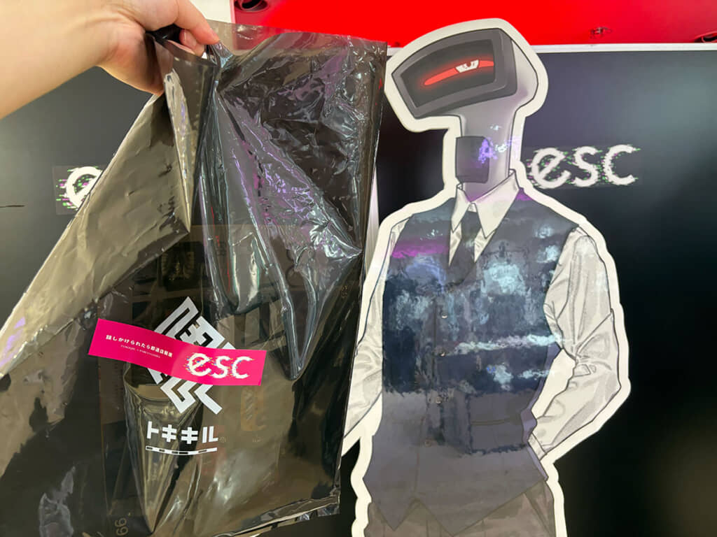 「店長」のパネルと買った物