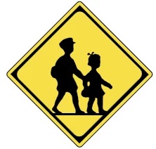 子ども2人の「飛び出し注意」標識の画像