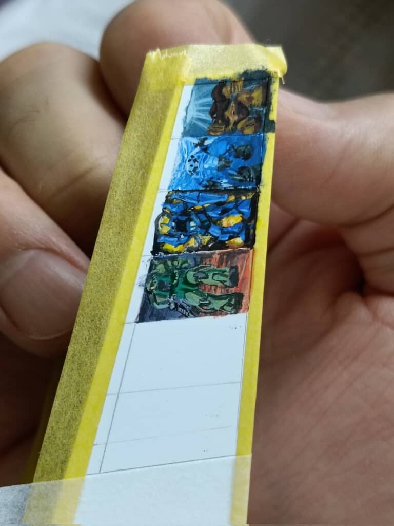 スタンド側面に他のキットのイラストを描く様子