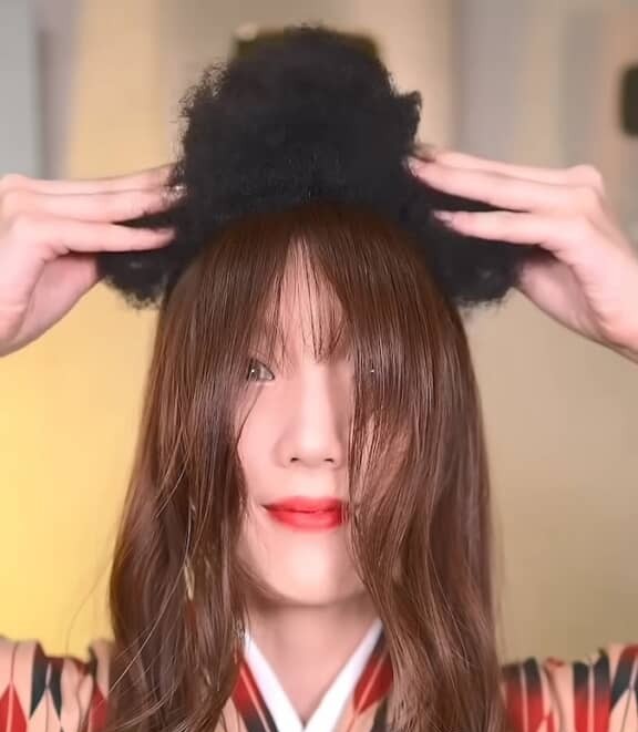 帽子をかぶって高さ調整