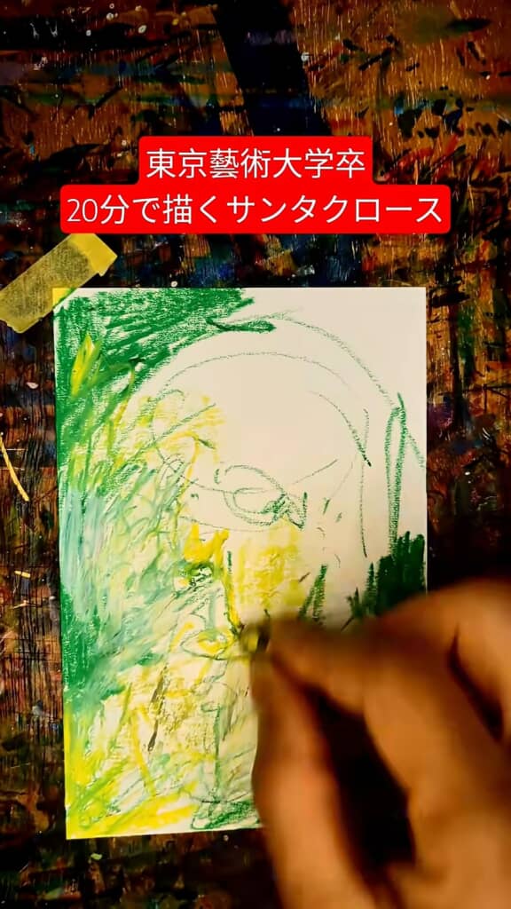 サンタクロースの顔周りを黄色と緑で色付けしている途中