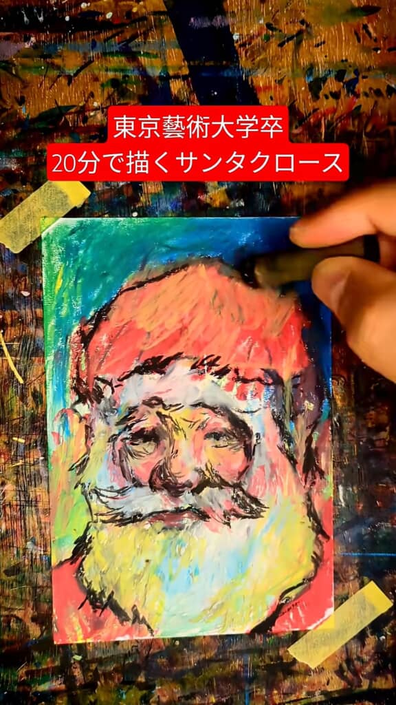 サンタクロースの絵を仕上げている様子