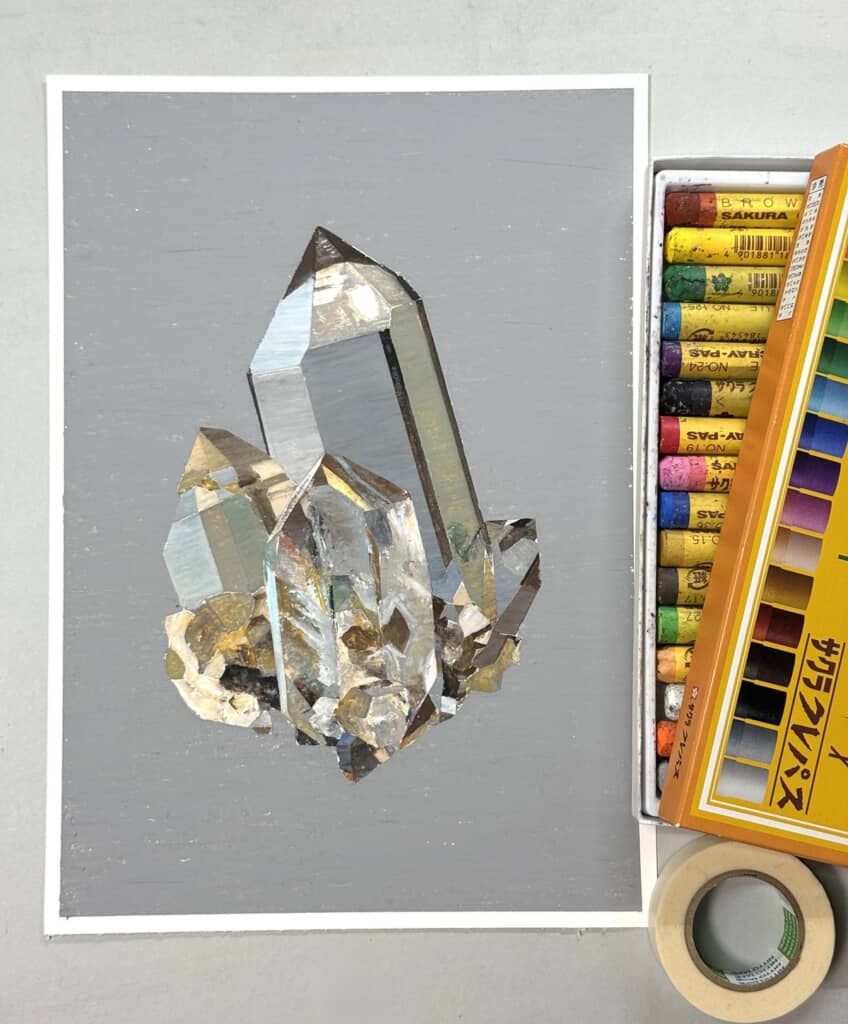 灰色の背景と立体的な鉱石の絵