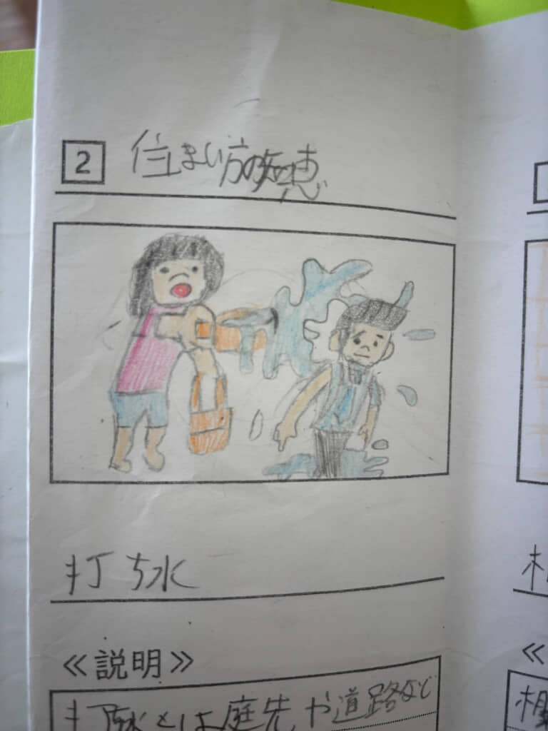 打ち水が盛大に直撃してる!