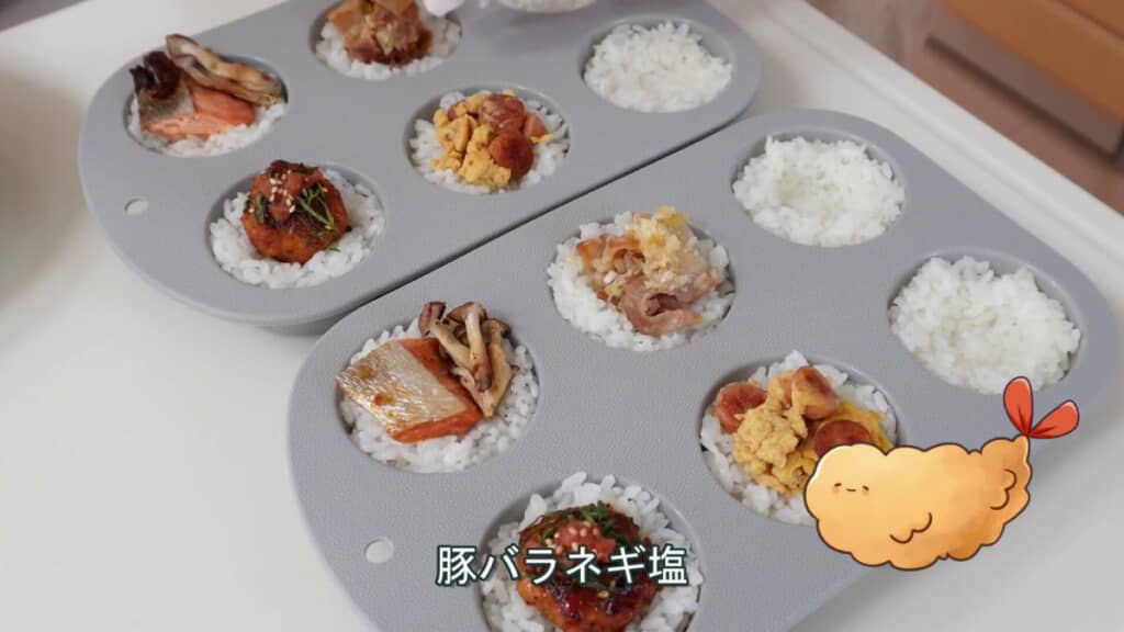 マフィン容器にごはんを詰めていく